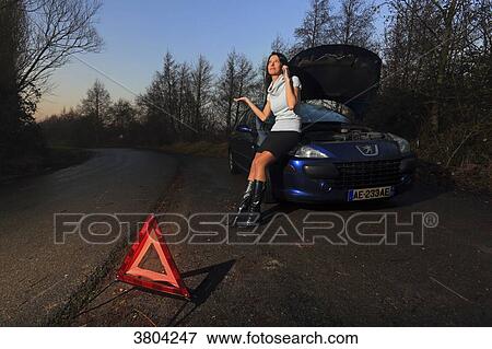 Woman and car. Problem View Large Photo Image Stock Photo - Woman and car. Problem. Fotosearch