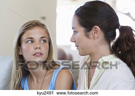 Stock Image - Woman discussing with her daughter. Fotosearch