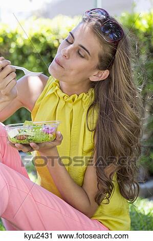 Woman eating salad View Large Photo Image Stock Image - Woman eating salad. Fotosearch
