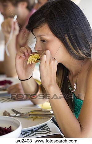 Woman enjoying lunch View Large Photo Image Stock Photo - Woman enjoying lunch. Fotosearch