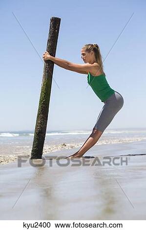 Woman exercising on the beach View Large Photo Image Stock Image - Woman exercising on the beach. Fotosearch