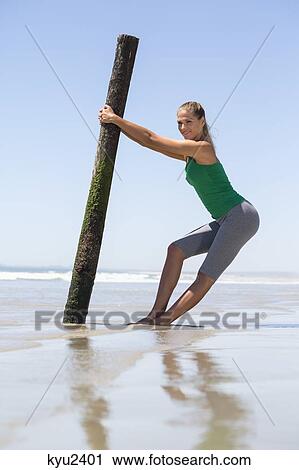Woman exercising on the beach View Large Photo Image Stock Image - Woman exercising on the beach. Fotosearch