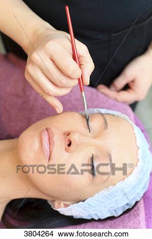 Woman in a beauty parlour.. Make up View Large Photo Image Picture - Woman in a beauty parlour.. Make up. Fotosearch
