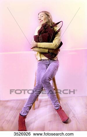 Stock Photograph - Woman loving her bag. Fotosearch