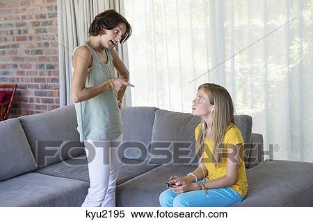 Stock Photography - Woman scolding her daughter. Fotosearch