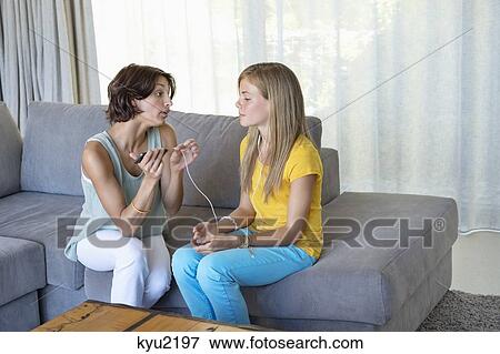 Stock Photo - Woman talking to her daughter. Fotosearch
