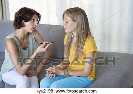 Stock Photo - Woman talking to her daughter. Fotosearch