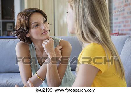 Woman talking to her daughter View Large Photo Image Stock Photo - Woman talking to her daughter. Fotosearch