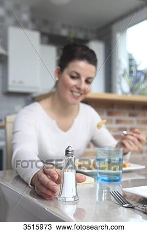 Woman with saltshaker View Large Photo Image Stock Image - Woman with saltshaker. Fotosearch