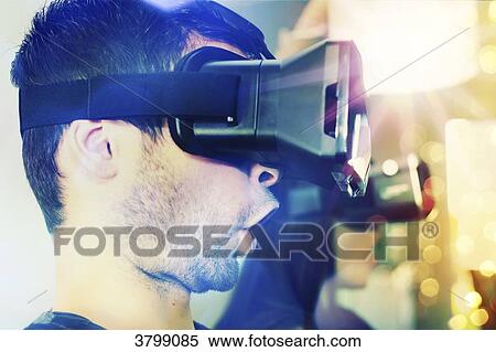 Young couple at home using virtual mask View Large Photo Image Stock Photography - Young couple at home using virtual mask. Fotosearch