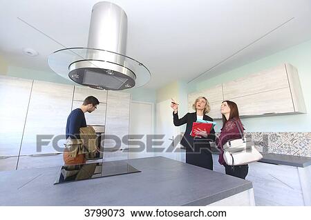 Young couple with estate agent. View Large Photo Image Stock Image - Young couple with estate agent.. Fotosearch