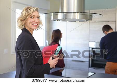 Young couple with estate agent. View Large Photo Image Stock Photo - Young couple with estate agent.. Fotosearch