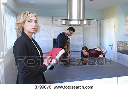 Young couple with estate agent. View Large Photo Image Stock Photograph - Young couple with estate agent.. Fotosearch