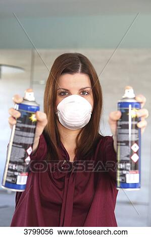 Young woman at home using air spray View Large Photo Image Stock Photograph - Young woman at home using air spray. Fotosearch