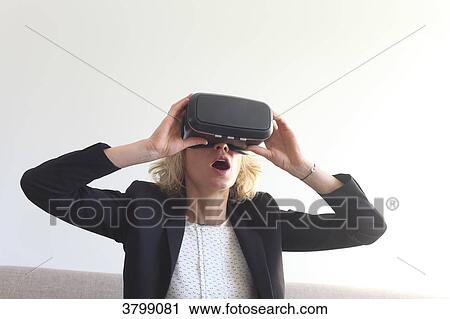 Young woman at home using virtual mask View Large Photo Image Stock Image - Young woman at home using virtual mask. Fotosearch