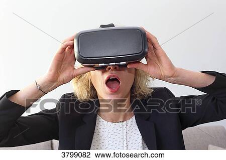 Young woman at home using virtual mask View Large Photo Image Stock Image - Young woman at home using virtual mask. Fotosearch