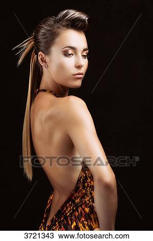 Young woman, hand on hip, looking down View Large Photo Image Stock Image - Young woman, hand on hip, looking down. Fotosearch