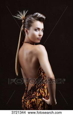 Young woman, hands on hips, looking away View Large Photo Image Picture - Young woman, hands on hips, looking away. Fotosearch