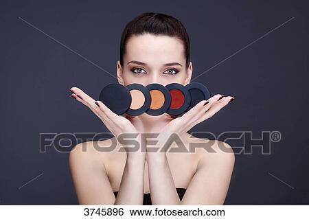 Young woman has an assortment of blusher View Large Photo Image Stock Photograph - Young woman has an assortment of blusher. Fotosearch
