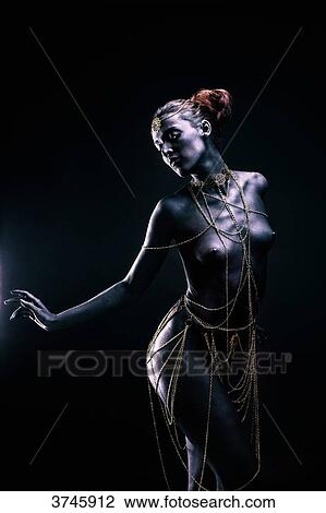 Young woman in light of ethnic ceremony, Length, profile, one hand on the side, looking down View Large Photo Image Stock Image - Young woman in light of ethnic ceremony, Length, profile, one hand on the side, looking down. Fotosearch