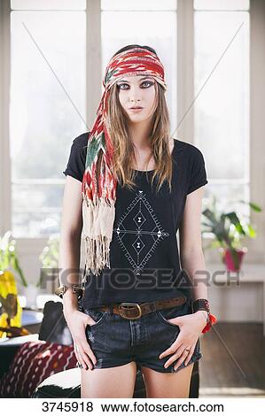 Young woman in shorts, t-shirt and headband Sanhadja View Large Photo Image Stock Photo - Young woman in shorts, t-shirt and headband Sanhadja. Fotosearch
