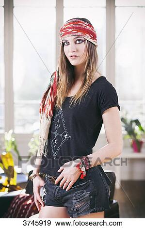 Young woman in shorts, t-shirt and headband Sanhadja View Large Photo Image Stock Photo - Young woman in shorts, t-shirt and headband Sanhadja. Fotosearch