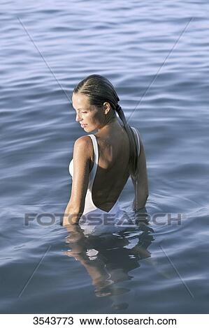 Young woman in the sea View Large Photo Image Stock Image - Young woman in the sea. Fotosearch