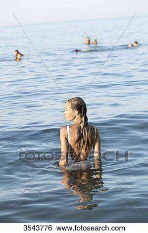 Young woman in the sea View Large Photo Image Stock Photograph - Young woman in the sea. Fotosearch