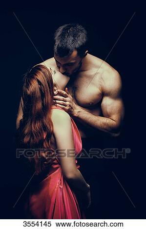 Young woman kissing man View Large Photo Image Stock Photography - Young woman kissing man. Fotosearch