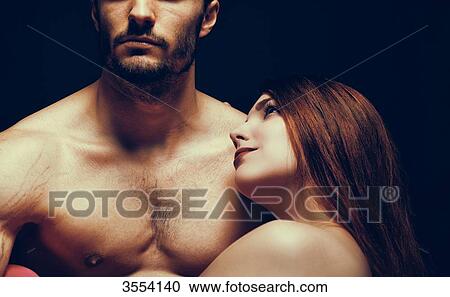 Stock Image - Young woman looking at her lovingly man. Fotosearch