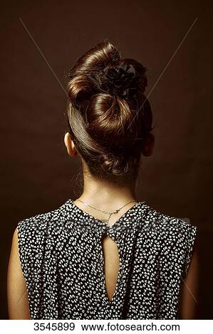 Young woman, rear view View Large Photo Image Stock Photo - Young woman, rear view. Fotosearch