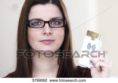 Stock Image - Young woman with RFID protection system. Fotosearch