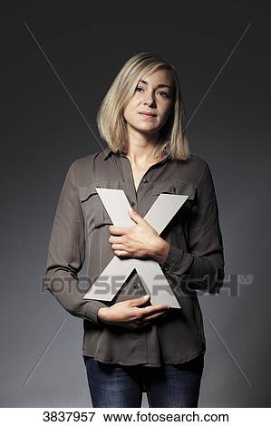 Young woman with X letter View Large Photo Image Stock Photo - Young woman with X letter. Fotosearch