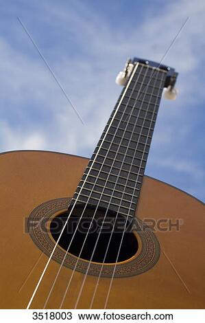 Acoustic guitar sight in low-angle shot. View Large Photo Image Stock Image - Acoustic guitar sight in low-angle shot.. Fotosearch