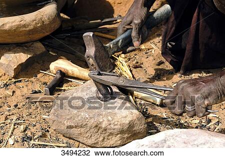 Africa, Mali, art and craft, Dogon blacksmith nearby Ireli View Large Photo Image Stock Image - Africa, Mali, art and craft, Dogon blacksmith nearby Ireli. Fotosearch