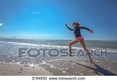 Attractive young women running on the beach, Pas de Calais, Bitch., Pas de Calais, Bitch. View Large Photo Image Stock Photography - Attractive young women running on the beach, Pas de Calais, Bitch., Pas de Calais, Bitch.. Fotosearch