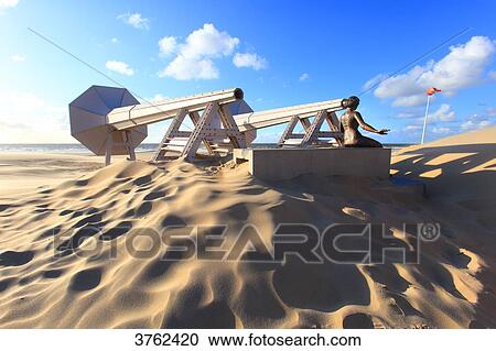 Stock Image - Belgium. Westende Bad. Art on the beach. Beaufort04. I Can Hear It, from Ivars Drulle. Fotosearch