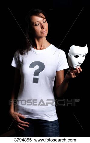 Brown woman in studio with a tee shirt with t a question mark and holding a mask in her hand. Conceptual image on the theme Born under X. View Large Photo Image Stock Photography - Brown woman in studio with a tee shirt with t a question mark and holding a mask in her hand. Conceptual image on the theme Born under X.. Fotosearch