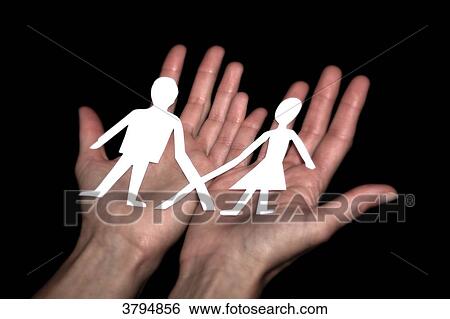 Stock Photograph - Brown woman in studio. With X letter on T-shirt.. Fotosearch