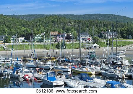 Stock Photograph - Canada, Province of Quebec. Estuary of the Saint Laurent. The marina of Tadoussac, world capital of whale watching. Fotosearch