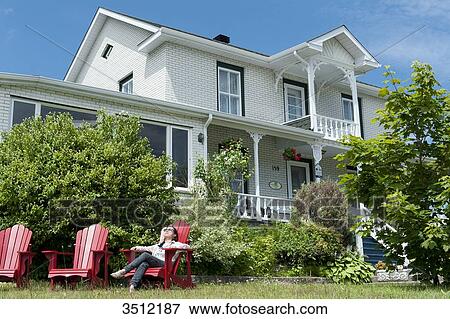 Stock Photo - Canada, Province of Quebec. Hotel in Tadoussac, world capital of whale watching. Fotosearch