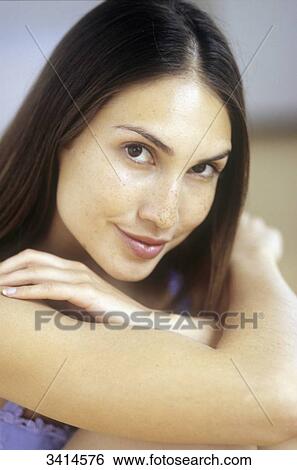 Close-up of a dark haired young woman View Large Photo Image Stock Photograph - Close-up of a dark haired young woman. Fotosearch