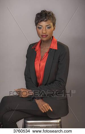 Close up of a young attractive African women wearing a cblack tailor jacket View Large Photo Image Picture - Close up of a young attractive African women wearing a cblack tailor jacket. Fotosearch