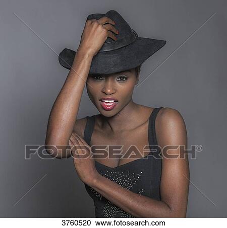 Close up of a young attractive African women with hat View Large Photo Image Stock Image - Close up of a young attractive African women with hat. Fotosearch