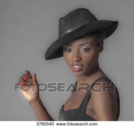 Close up of a young attractive African women with hat View Large Photo Image Stock Image - Close up of a young attractive African women with hat. Fotosearch