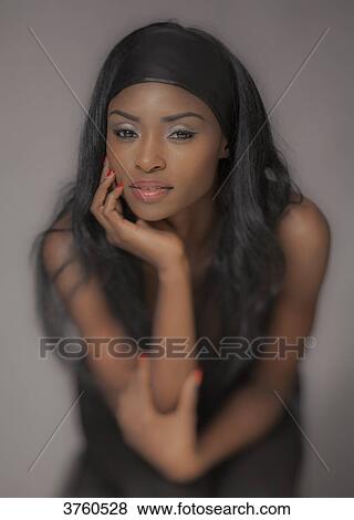 Close up of a young attractive African women View Large Photo Image Stock Photo - Close up of a young attractive African women. Fotosearch