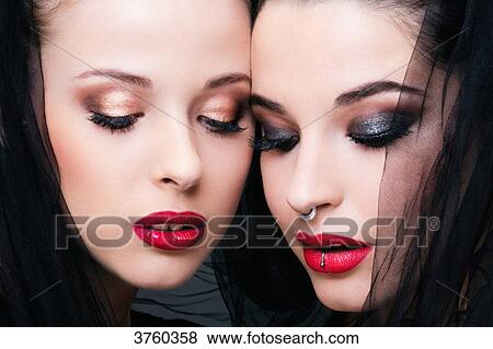 Close up of two young women in profile, looking down View Large Photo Image Stock Photo - Close up of two young women in profile, looking down. Fotosearch