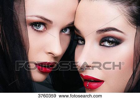 Close up of two young women in profile, looking to the camera View Large Photo Image Stock Photo - Close up of two young women in profile, looking to the camera. Fotosearch