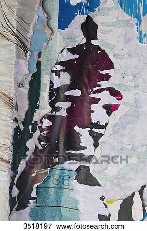 Stock Photo - Close-up on torn posters.. Fotosearch