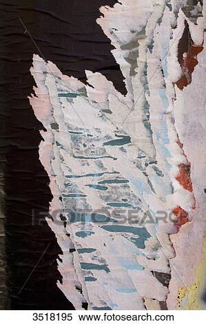 Stock Photography - Close-up on torn posters.. Fotosearch